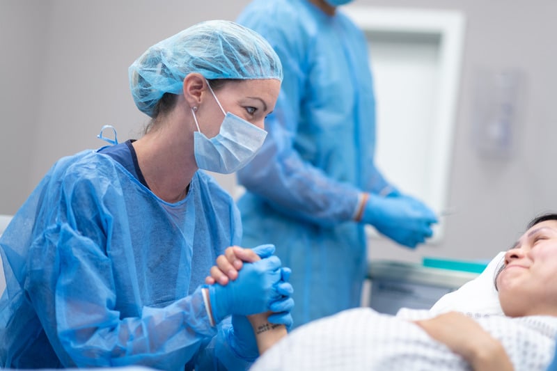 Doctor Holding Patient's Hand Before Surgery